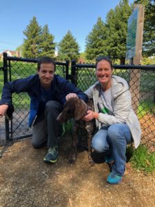 Jack2 with his new mom and dad in front of a low wire fence