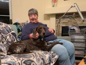 Mtn Scout on the sofa with his new mom