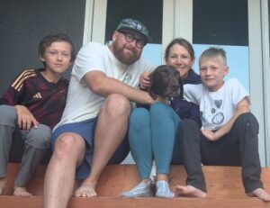 Argus with his new forever family.