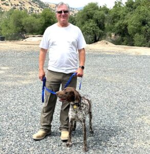 Paco standing next to his forever dad