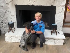 Trexie with her new forever human brother.