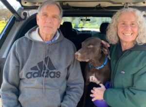 Rusty with his new mom and dad.