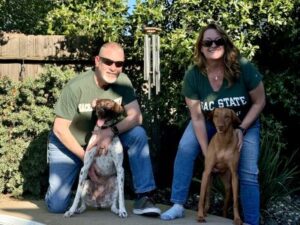 Cedar with her new Mom and Dad, and fur sister Ruby.