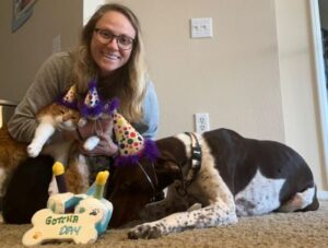 Artamus with his new mom and cat siblings.