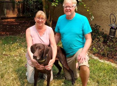 Brownie with his new forever Mom and Dad.