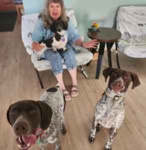 Williams with his new forever Mom and fur siblings.