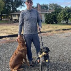 Duke with his new Dad, and one of his fur siblings.