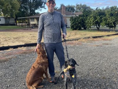 Duke with his new Dad, and one of his fur siblings.