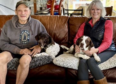 Maddie with her new Mom and Dad, and K9 sibling.