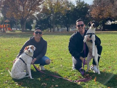 Paige with her new forever Dads, and new canine sister.