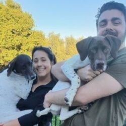 Maisie with her new mom and dad and fur sister.