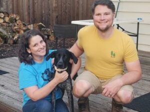 Picture of Iris with her new forever Mom and Dad.