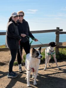 Abe with his new family standing by the sea